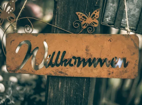 german word wilkommen written on a sign